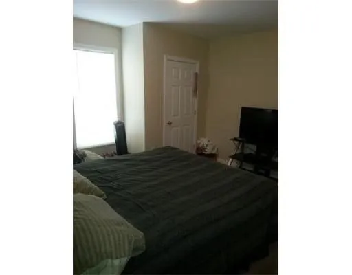 a bedroom with a bed and a cabinets