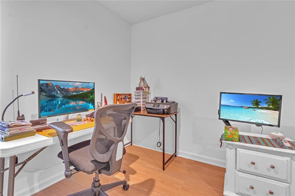 301 Cobblestone Trail Avondale Estates, GA 30002 - Photo 16 of 25 a workspace with furniture and a flat screen tv