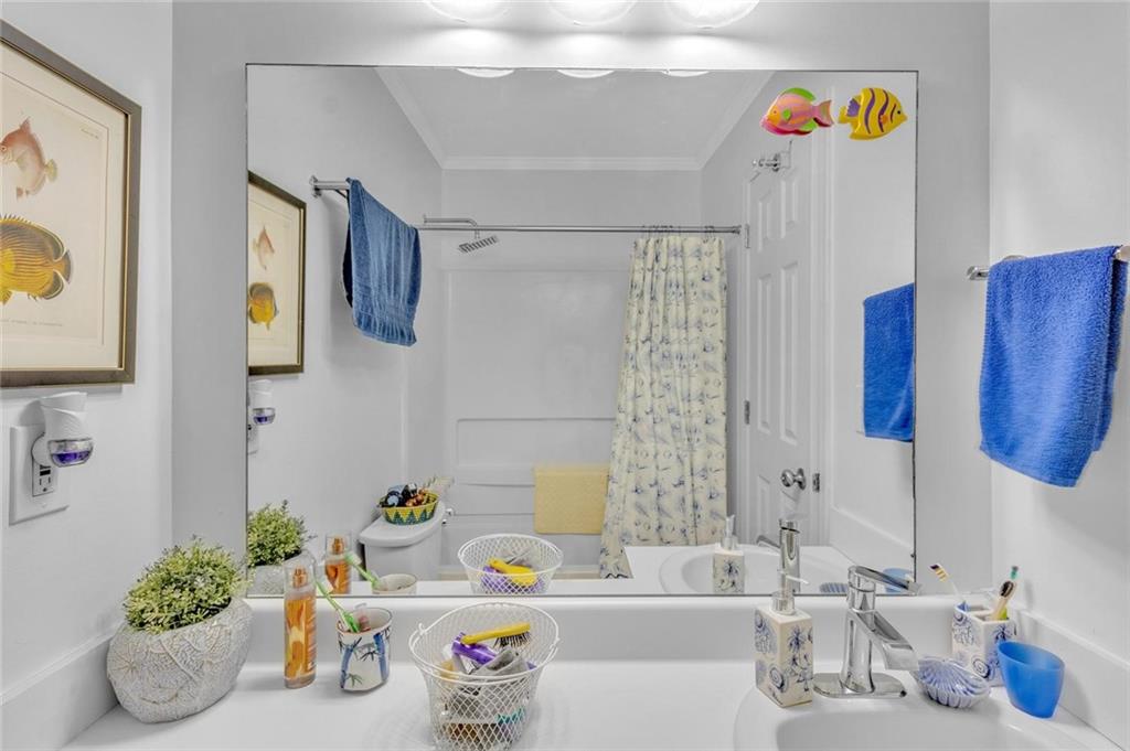 301 Cobblestone Trail Avondale Estates, GA 30002 - Photo 17 of 25 a bathroom with a sink mirror and vanity