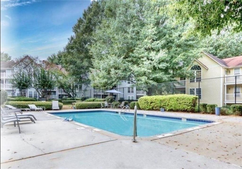 301 Cobblestone Trail Avondale Estates, GA 30002 - Photo 21 of 25 a view of a swimming pool with a house
