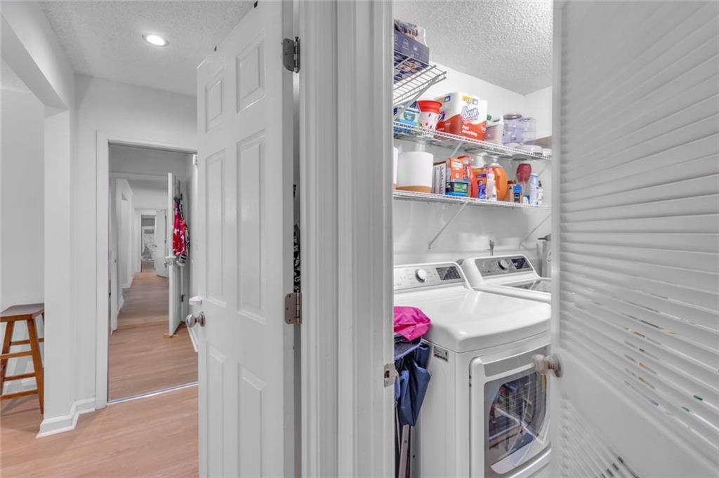 301 Cobblestone Trail Avondale Estates, GA 30002 - Photo 9 of 25 a storage room with washer and dryer