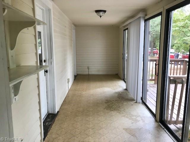 7702 Summerfield Road Summerfield, NC 27358 - Photo 16 of 21 Side porch to deck - not counted in square footage