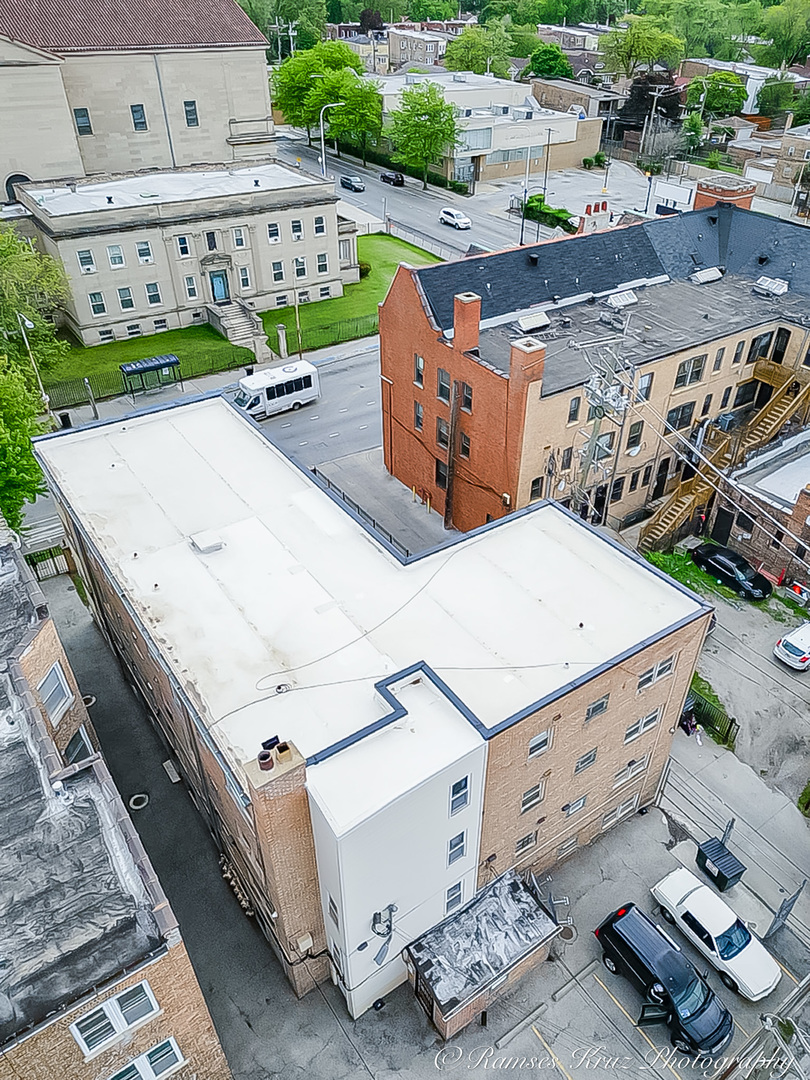 7844 South Jeffery Boulevard Chicago, IL 60649 - Photo 7 of 20 an aerial view of a house with garden space and street view