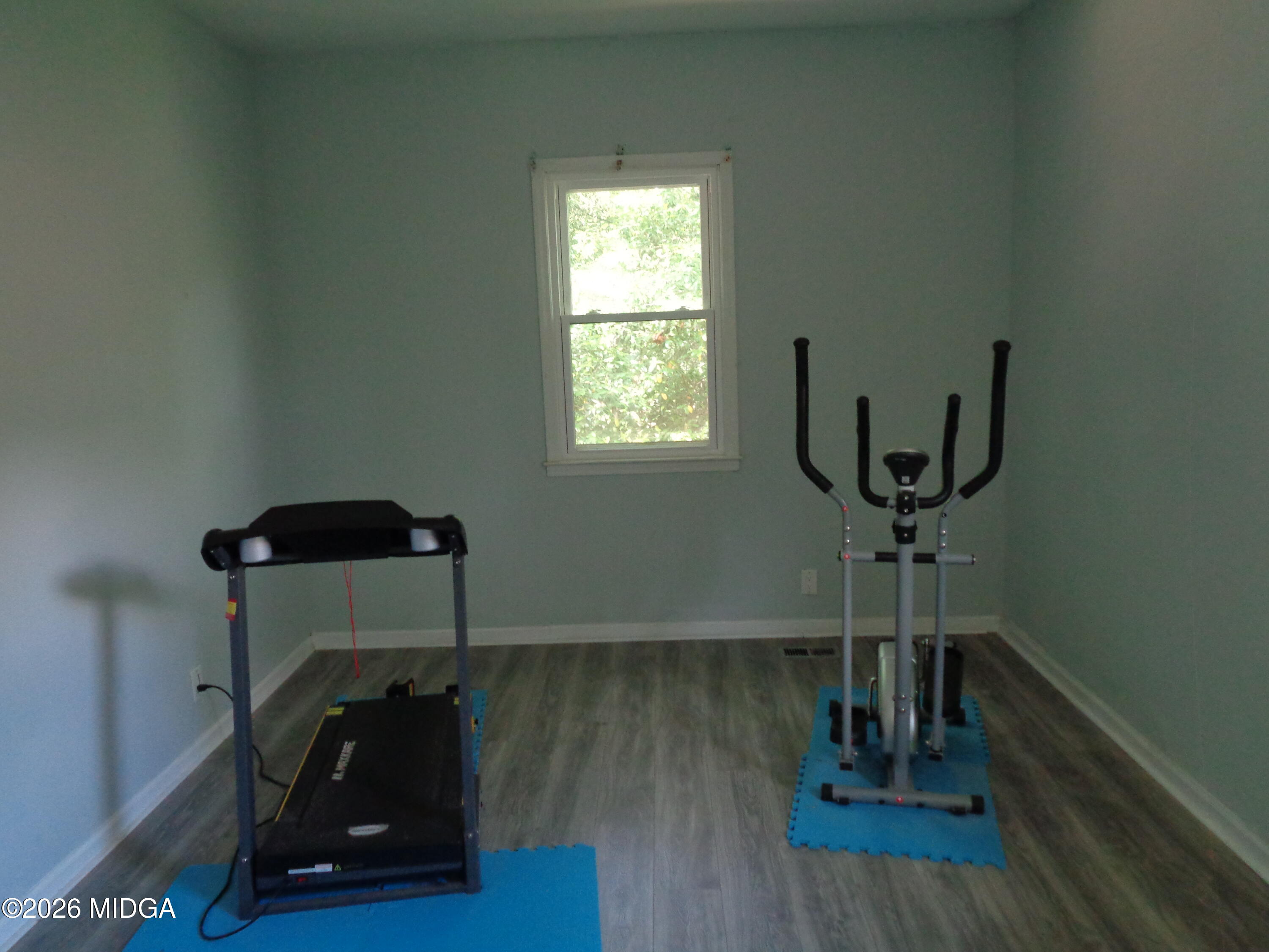 3380 Goodwin Lane Macon, GA 31217 - Photo 10 of 22 a room with wooden floor and windows