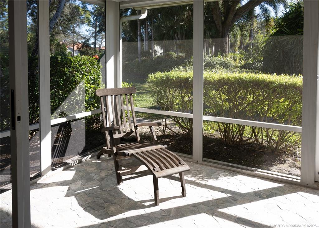 2425 Southwest Foxpoint Trail Palm City, FL 34990 - Photo 27 of 33 a view of balcony with two chairs and potted plants