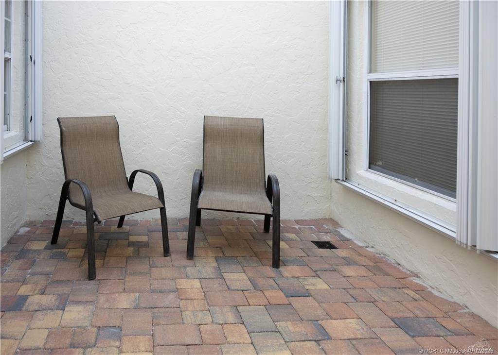 2425 Southwest Foxpoint Trail Palm City, FL 34990 - Photo 29 of 31 a view of a workspace with furniture and a window