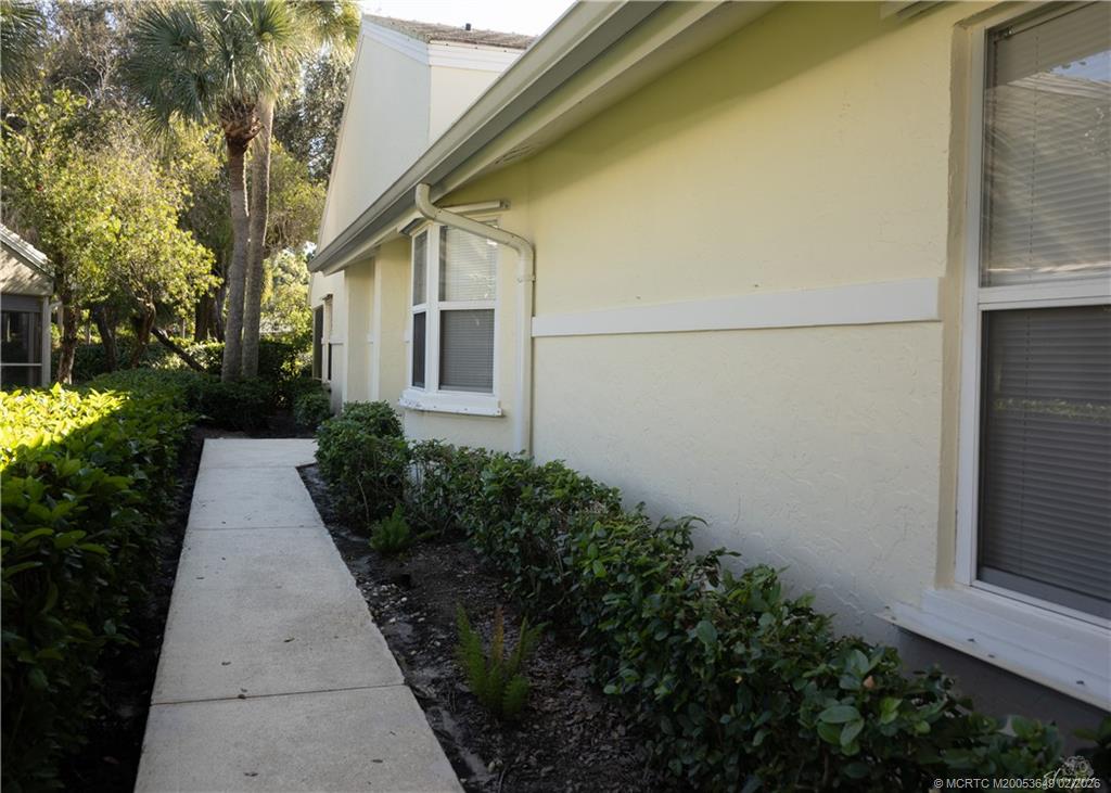 2425 Southwest Foxpoint Trail Palm City, FL 34990 - Photo 6 of 31 a house with trees in front of it