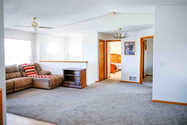 a bed room with furniture and a chandelier
