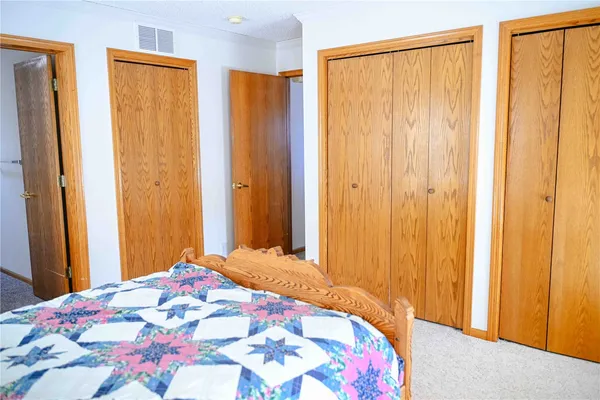 a bathroom with a toilet and a shower curtain