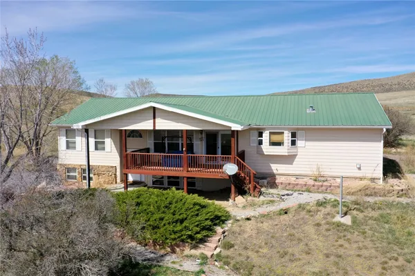 a view of a house with a mountain in the background