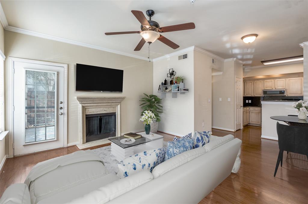 2601 Preston Road, Unit 6109 Plano, TX 75093 - Photo 3 of 16 a living room with furniture fireplace and a flat screen tv