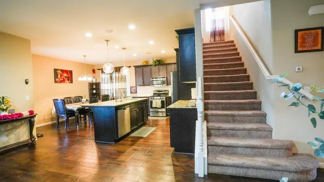 a view of kitchen with furniture and wooden floor