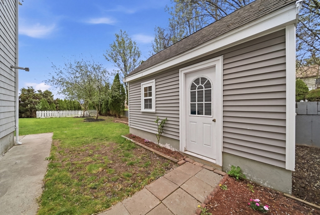 131 Range Heights Road Lynn, MA 01904 - Photo 34 of 36 a front view of a house with garden