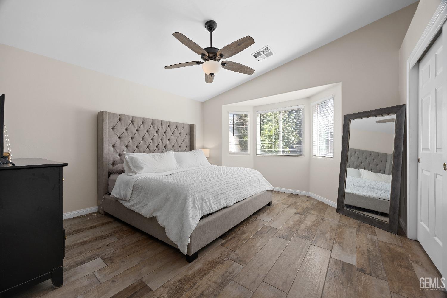 Undisclosed Address Bakersfield, CA 93311 - Photo 20 of 30 a bedroom with a large bed and a large window