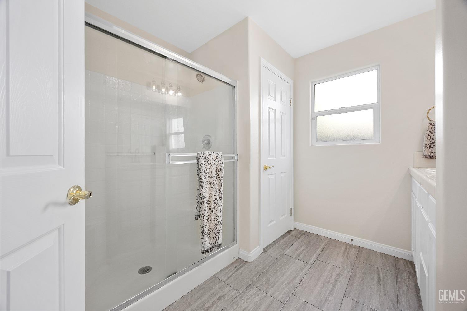 Undisclosed Address Bakersfield, CA 93311 - Photo 23 of 30 a bathroom with a shower