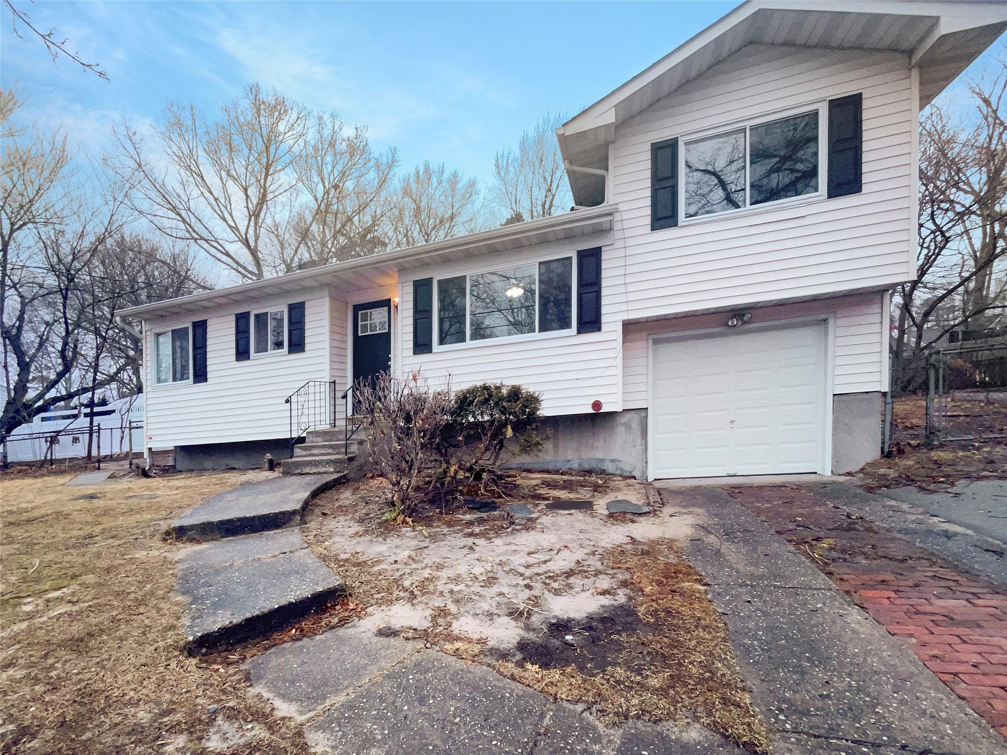23 Halliday Road Brookhaven, NY 11727 - Photo 1 of 1 View of front of house with a garage