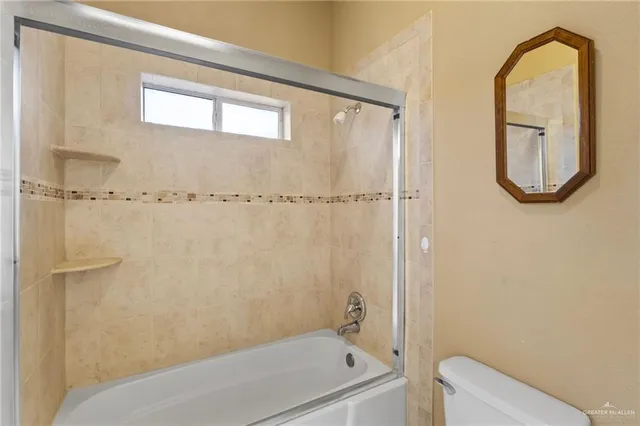 a bathroom with a shower and a bathtub