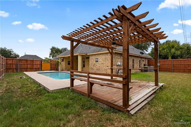 a view of a backyard with a deck