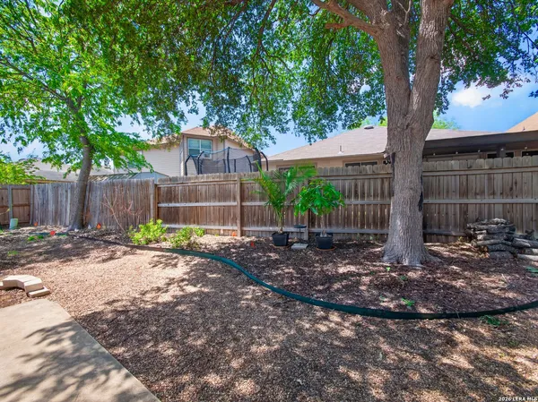 a backyard of a house with yard and outdoor seating