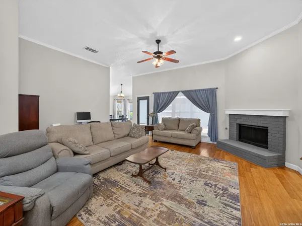a living room with furniture and a fireplace