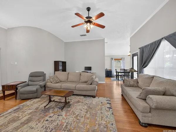 a living room with furniture and white walls
