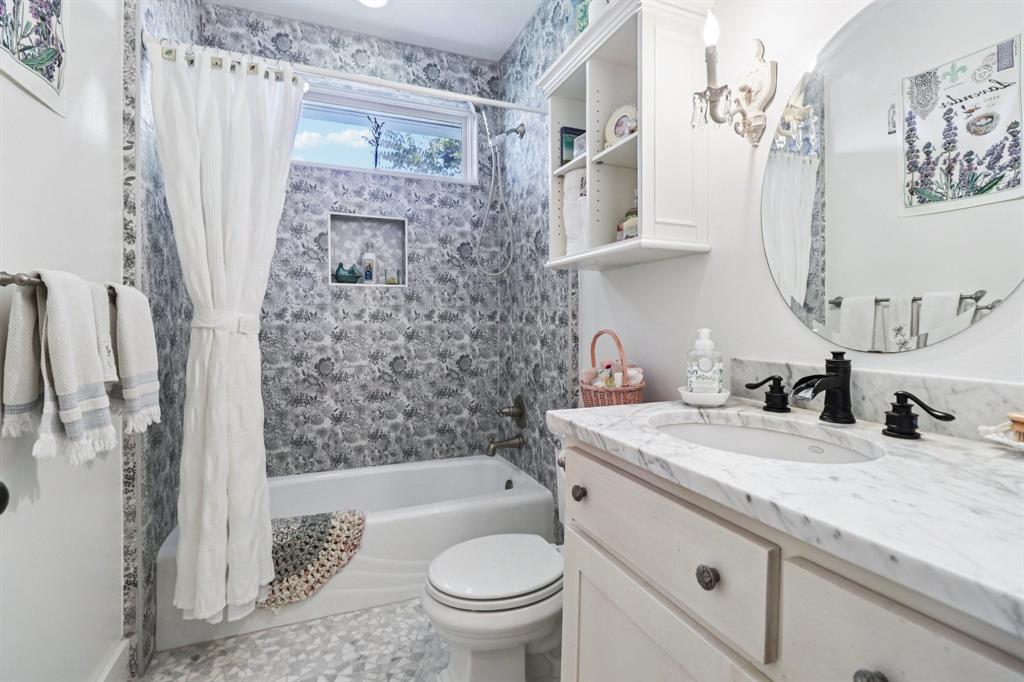 1590 Airport Road Aledo, TX 76008 - Photo 12 of 26 a bathroom with a granite countertop sink toilet and shower