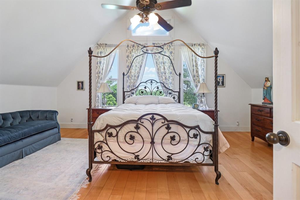 1590 Airport Road Aledo, TX 76008 - Photo 15 of 26 a bedroom with a bed and a chandelier