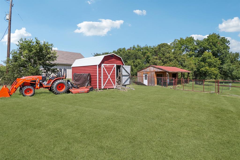 1590 Airport Road Aledo, TX 76008 - Photo 22 of 26 a front view of a house with garden