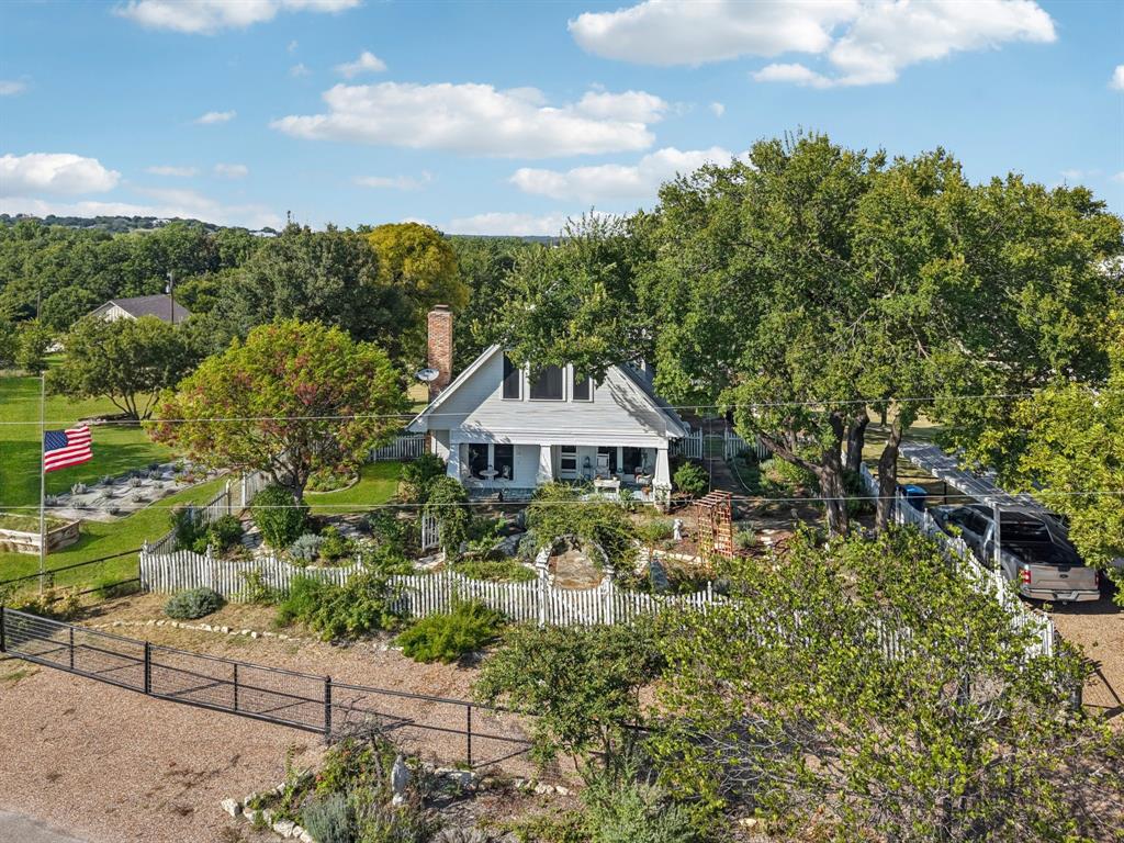 1590 Airport Road Aledo, TX 76008 - Photo 23 of 26 a view of a house with a yard and large trees