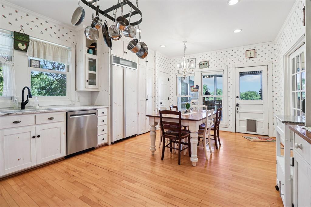 1590 Airport Road Aledo, TX 76008 - Photo 9 of 26 a view of a dining room with furniture and wooden floor