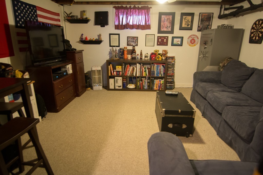 5 Farquhar Road Sturbridge, MA 01566 - Photo 16 of 27 a living room with furniture and a flat screen tv
