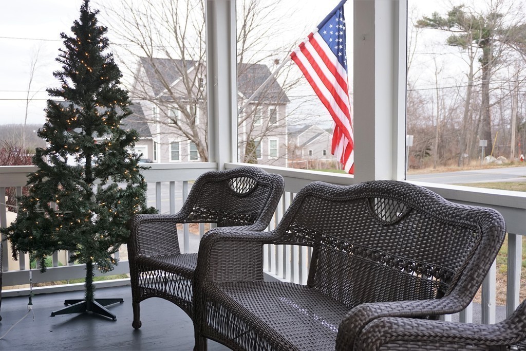 5 Farquhar Road Sturbridge, MA 01566 - Photo 20 of 27 a view of balcony with a couch and trees