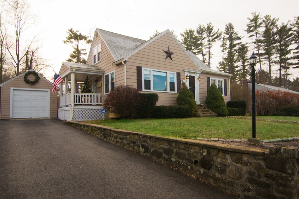 5 Farquhar Road Sturbridge, MA 01566 - Photo 25 of 27 a front view of a house with a garden and yard