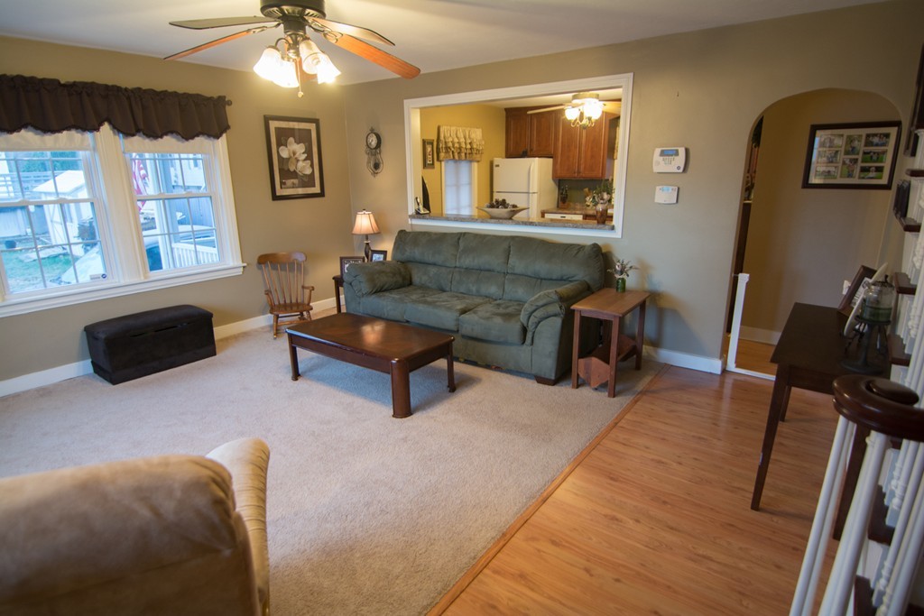 5 Farquhar Road Sturbridge, MA 01566 - Photo 3 of 27 a living room with furniture a chandelier and a flat screen tv