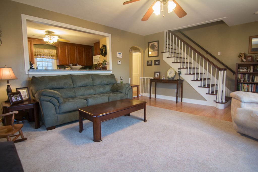 5 Farquhar Road Sturbridge, MA 01566 - Photo 4 of 27 a living room with furniture and a chandelier