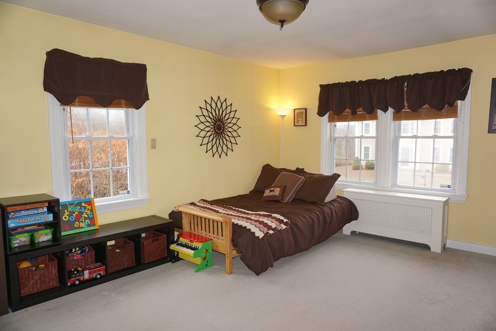 5 Farquhar Road Sturbridge, MA 01566 - Photo 7 of 27 a bedroom with a bed and a window