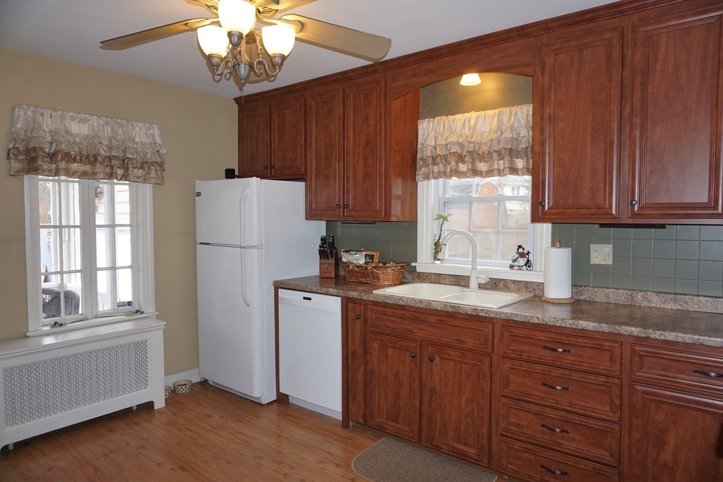 5 Farquhar Road Sturbridge, MA 01566 - Photo 9 of 27 a kitchen with a refrigerator a sink and cabinets