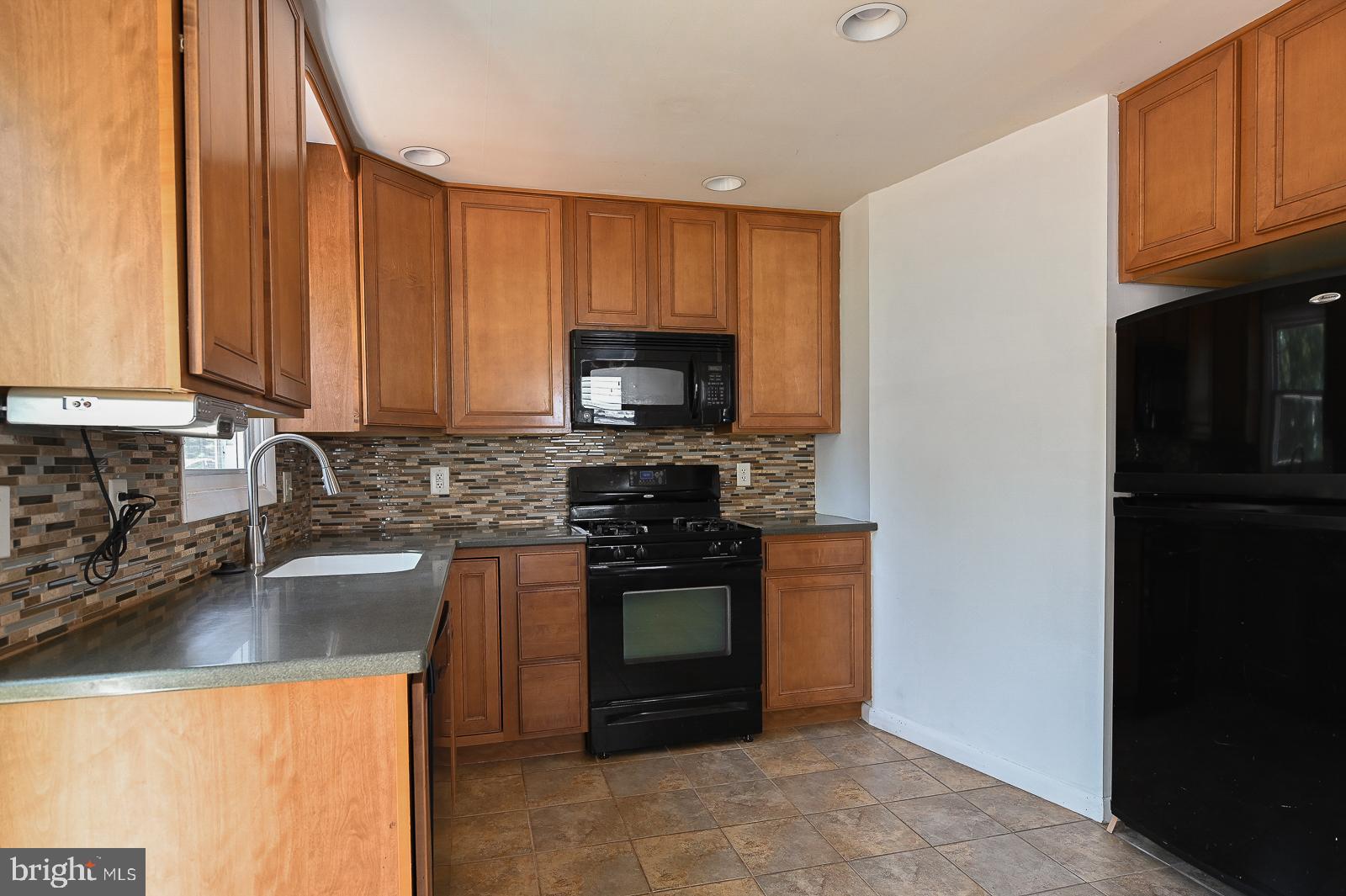 713 Valley Road Phoenixville, PA 19460 - Photo 18 of 36 Kitchen with tile backsplash