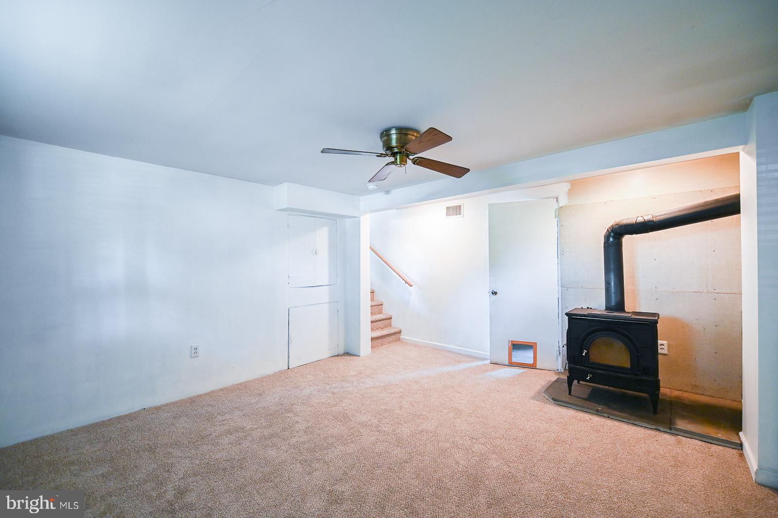713 Valley Road Phoenixville, PA 19460 - Photo 22 of 36 Living area with wood burning stove