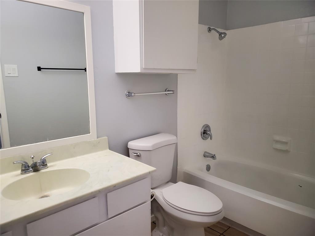 12482 Abrams Road, Unit 1402 Dallas, TX 75243 - Photo 17 of 32 a bathroom with a sink a toilet and shower