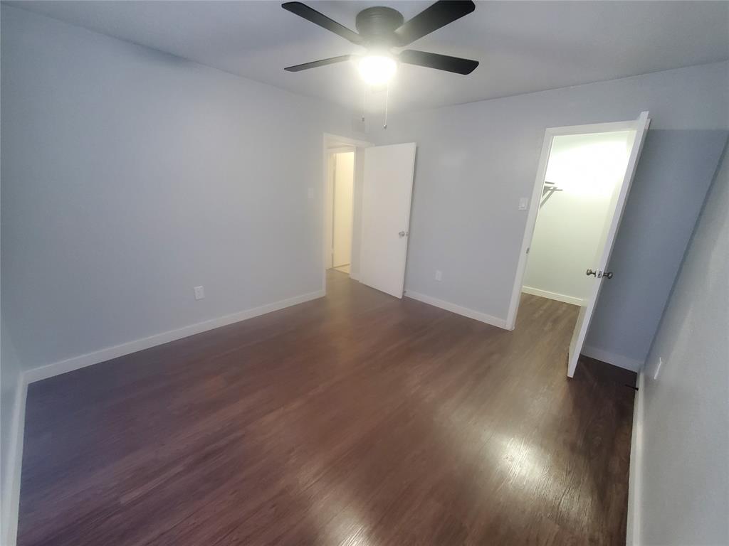 12482 Abrams Road, Unit 1402 Dallas, TX 75243 - Photo 20 of 32 an empty room with wooden floor and windows