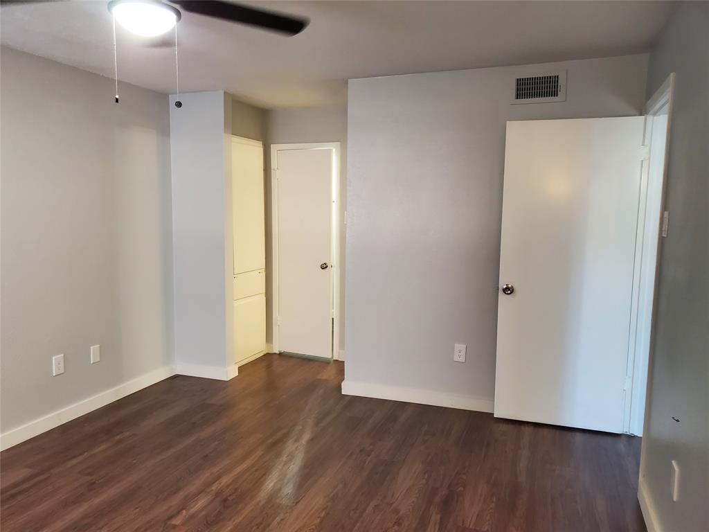 12482 Abrams Road, Unit 1402 Dallas, TX 75243 - Photo 23 of 32 a view of an empty room with wooden floor