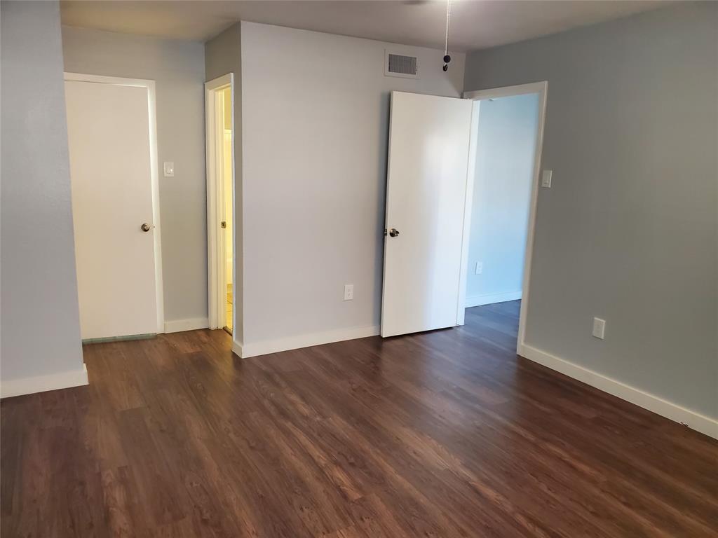 12482 Abrams Road, Unit 1402 Dallas, TX 75243 - Photo 24 of 32 a view of an empty room with wooden floor
