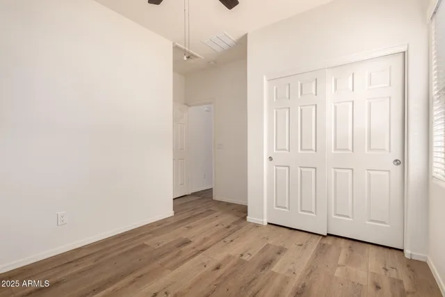 an empty room with wooden floor