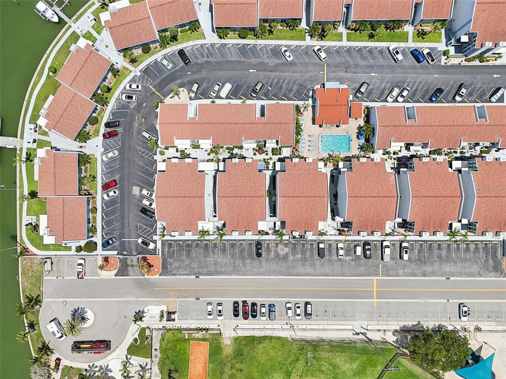 343 Rex Place, Unit F Madeira Beach, FL 33708 - Photo 24 of 28 a view of swimming pool with a yard and outdoor seating