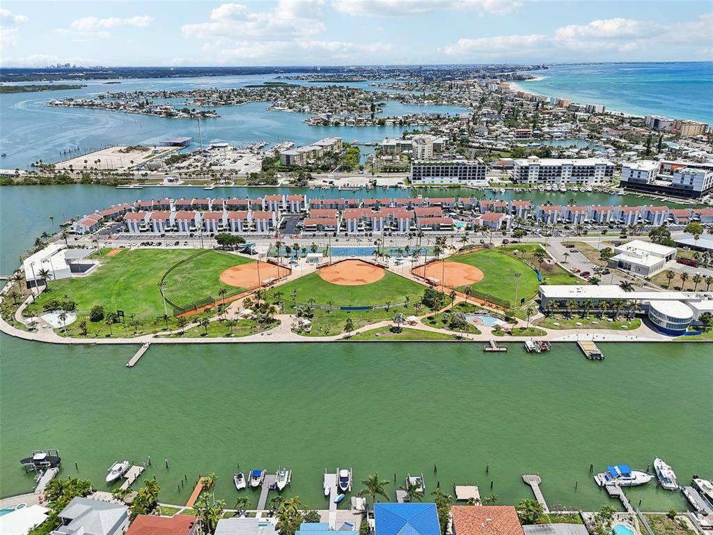 343 Rex Place, Unit F Madeira Beach, FL 33708 - Photo 3 of 28 a view of a city with an ocean view