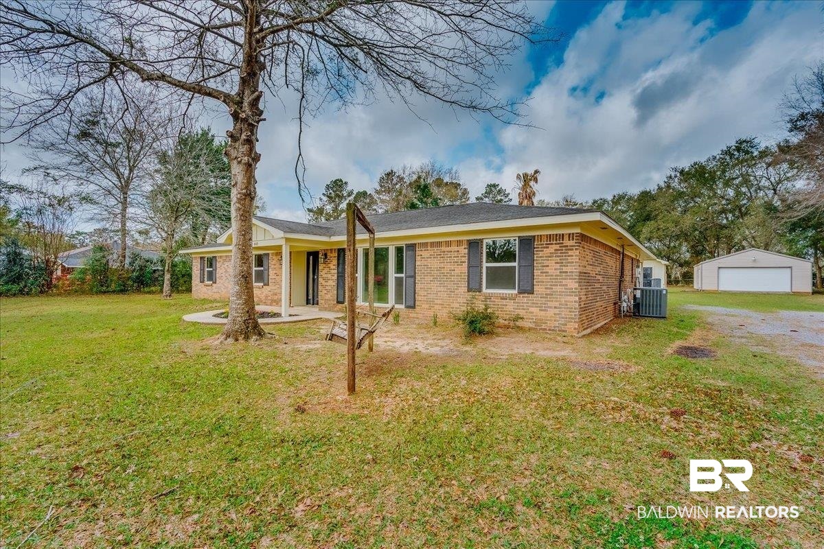 440 Dykes Road Mobile, AL 36608 - Photo 3 of 49 Single story home with a front yard, driveway, an outdoor structure, a garage, and brick siding
