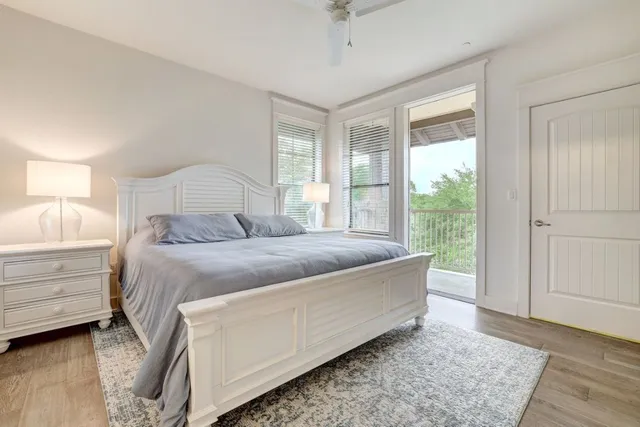 a bedroom with a large bed and a window