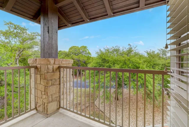 a view of a balcony with an outdoor space
