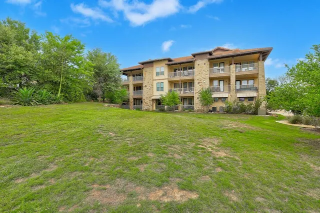 a view of a building with a big yard